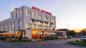 A modern hotel with a prominent sign reading "HOTEL ANTUNOVIĆ".