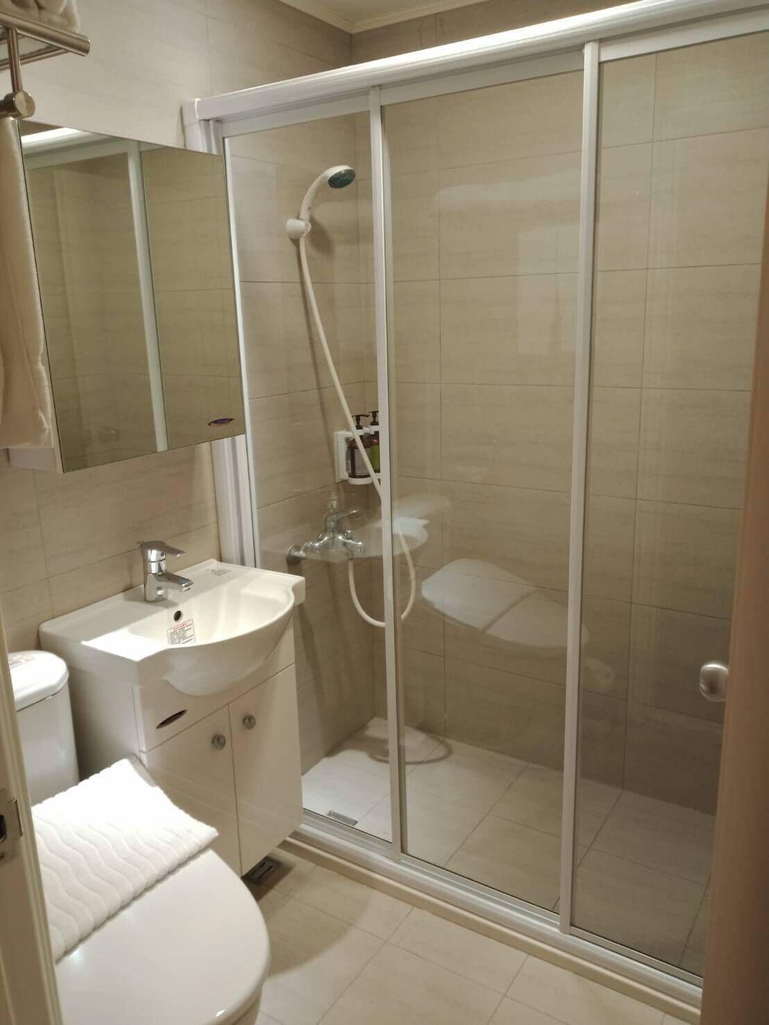 shower, hair dryer, slippers, electronic bidet