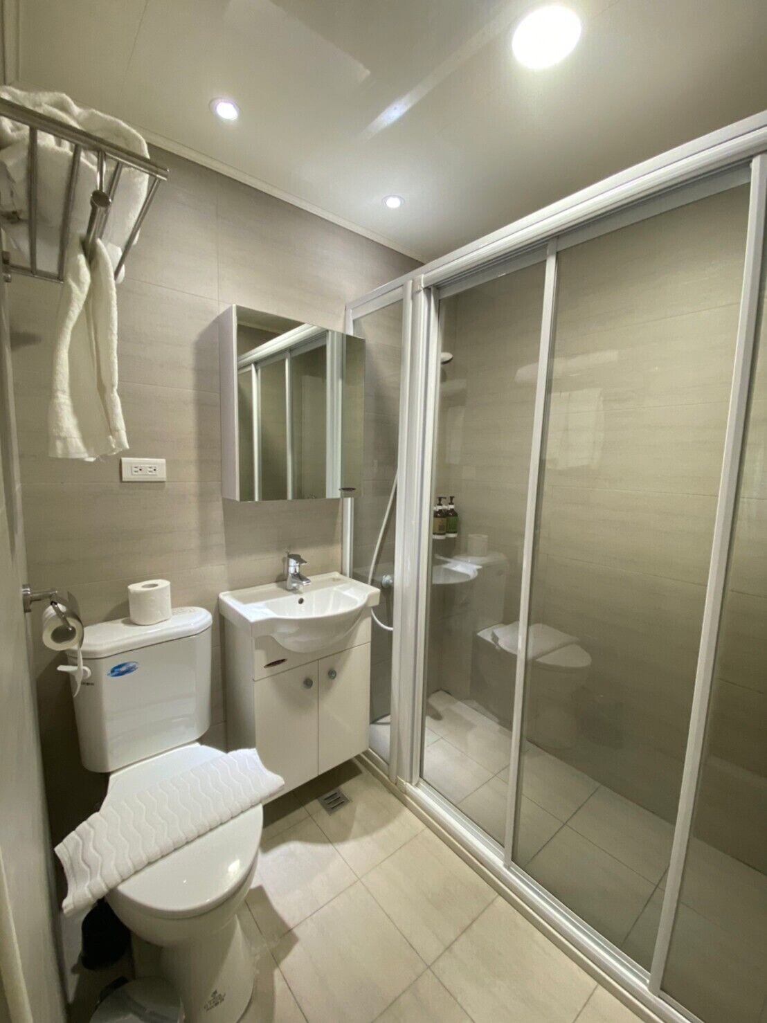 shower, hair dryer, slippers, electronic bidet