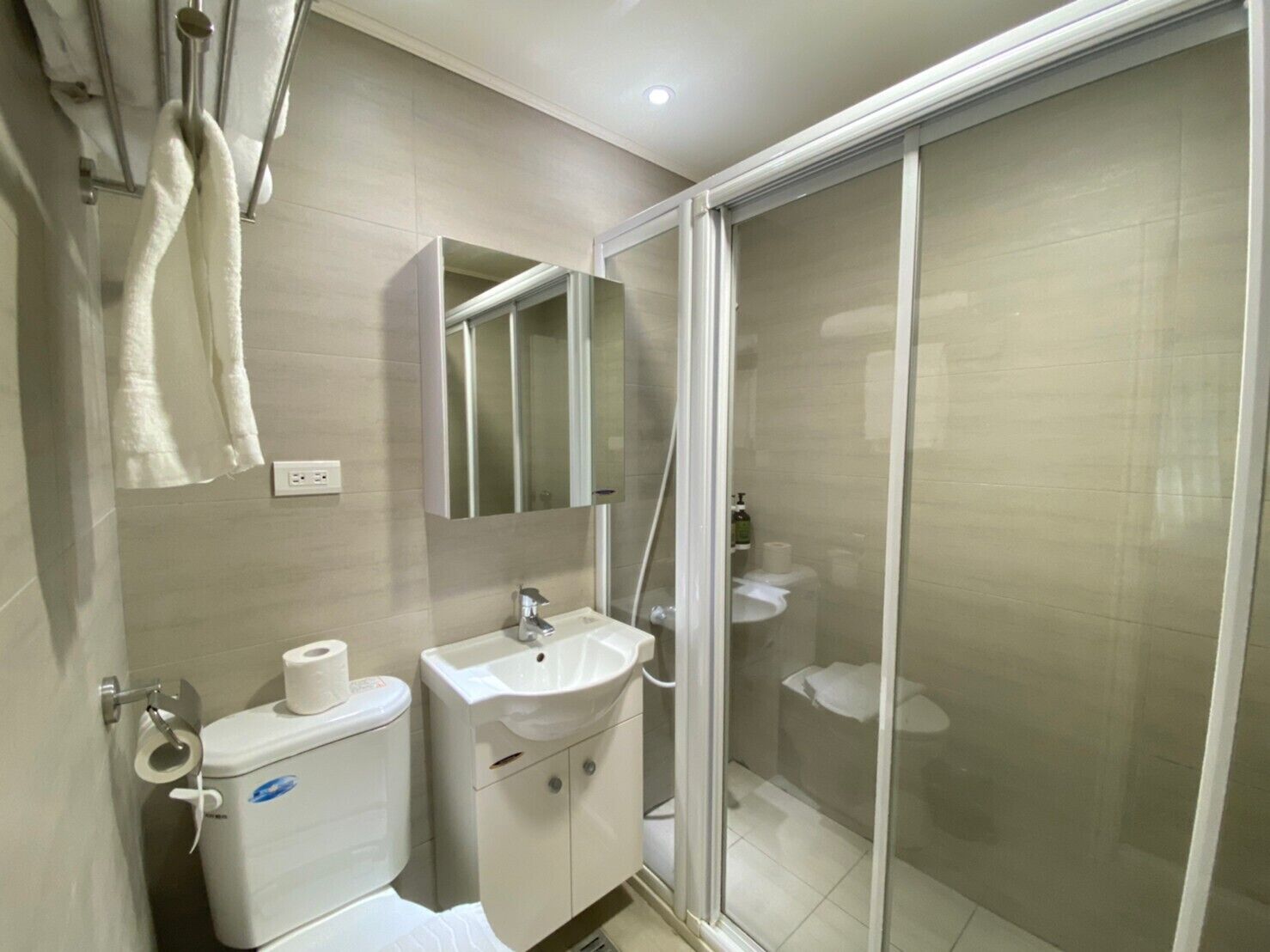 shower, hair dryer, slippers, electronic bidet