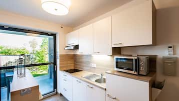 Apartment, 1 Bedroom | Private kitchen | Fridge, microwave, stovetop, dishwasher