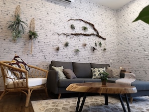 Tropical 2BR Apartment - Essential Travelers Only | Living room