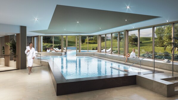 Indoor pool, pool umbrellas, pool loungers