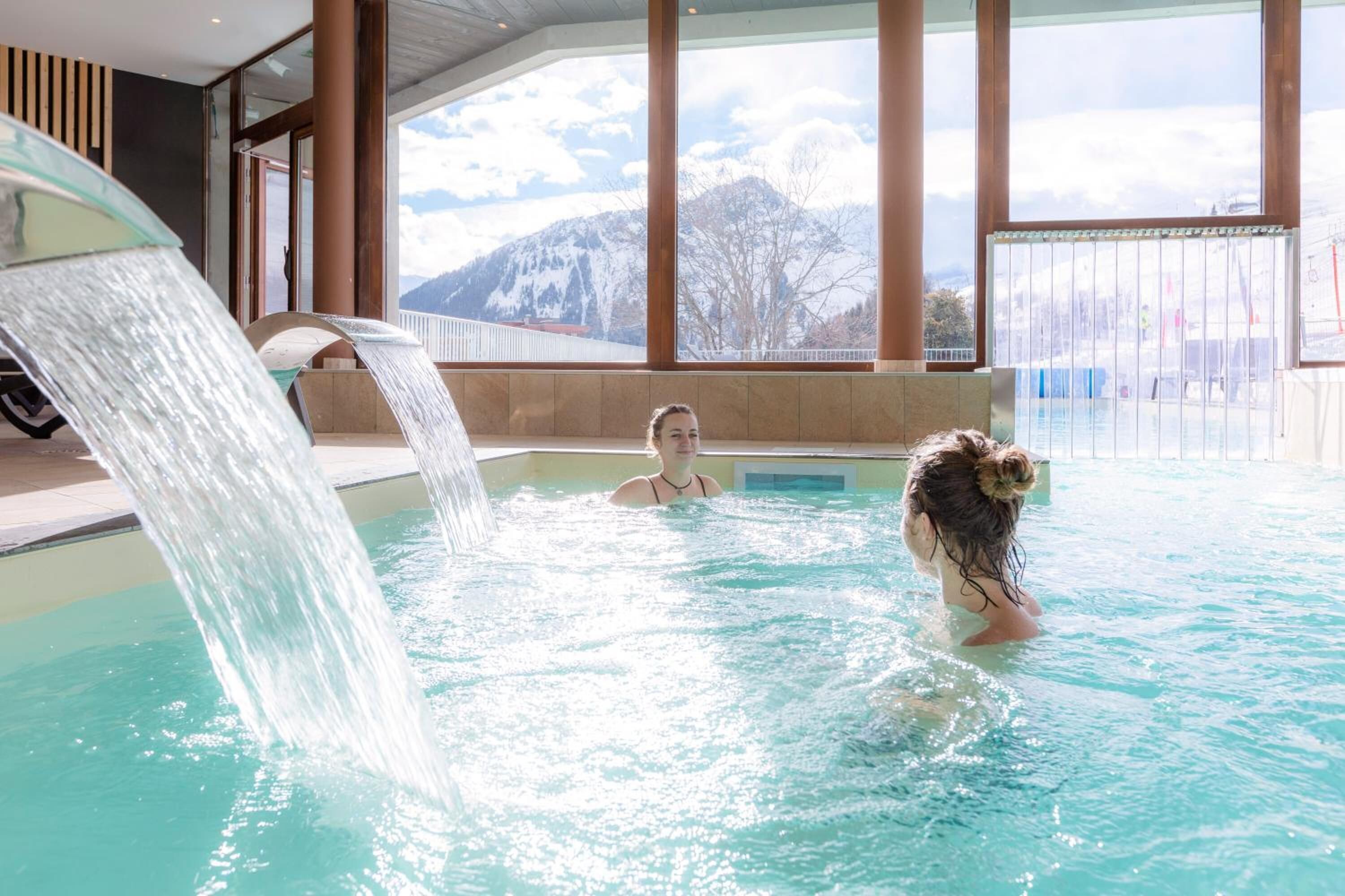 Indoor pool, pool umbrellas, pool loungers