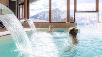 Indoor pool, pool umbrellas, pool loungers