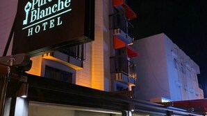The exterior of the Pure Blanche Hotel with its illuminated signage and modern architecture. - Pure Blanche Hotel (Antalya)