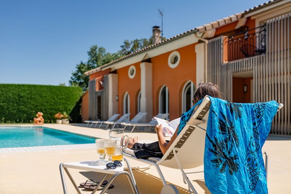 Seasonal outdoor pool, pool loungers