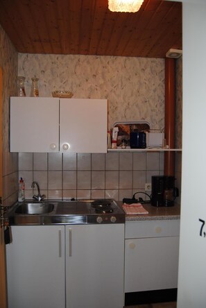 Fridge, coffee/tea maker, cookware/dishes/utensils