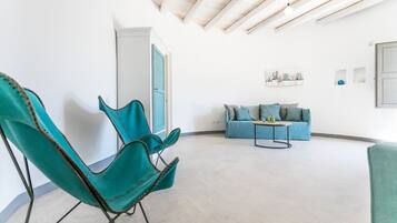 Superior Suite | Living area | 22-inch flat-screen TV with digital channels, TV