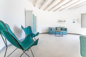 Superior Suite | Living area | 22-inch flat-screen TV with digital channels, TV