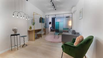 Senior Studio Suite | Living room | 81-inch LED TV with cable channels, TV