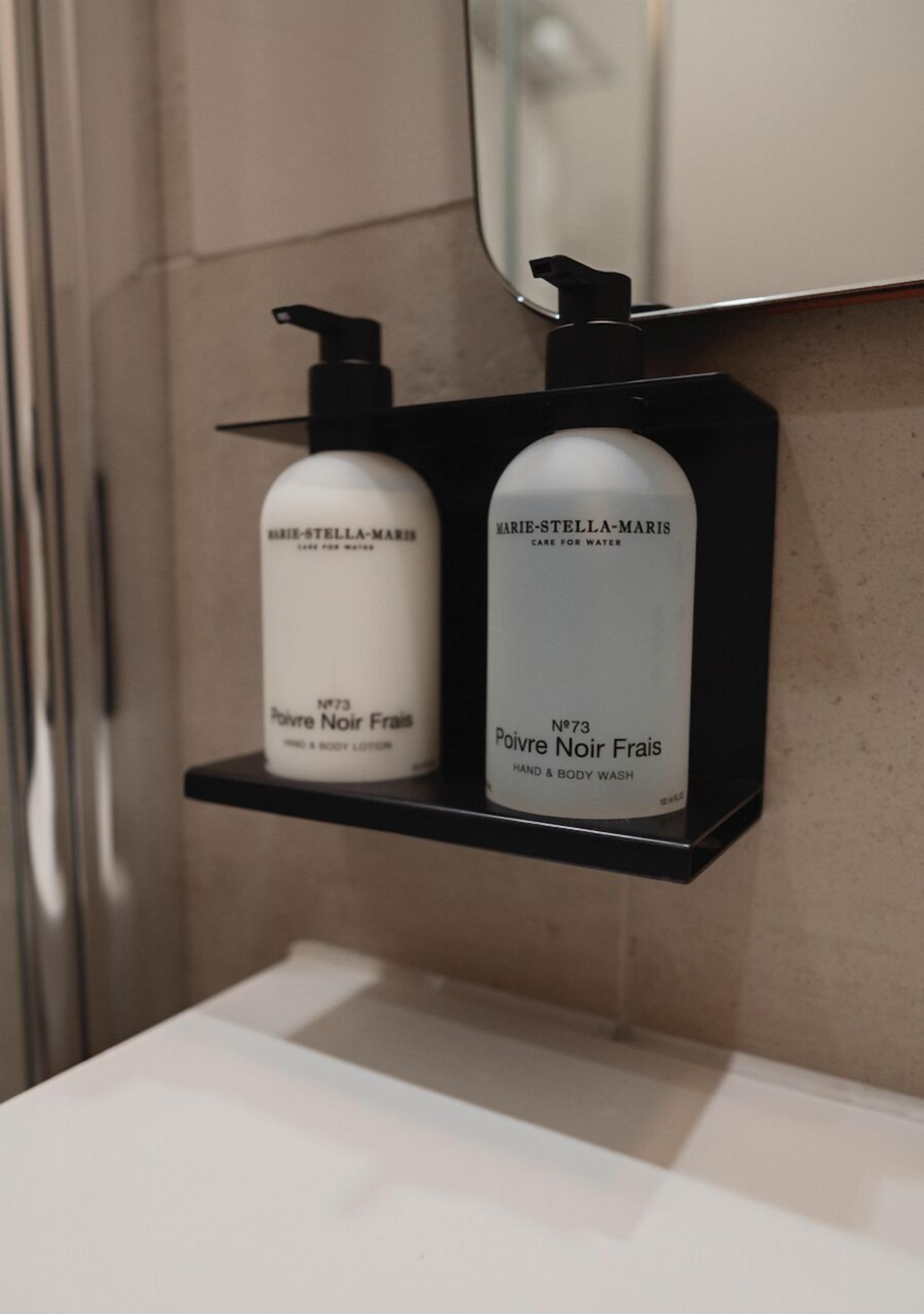 designer toiletries, hair dryer, towels, soap