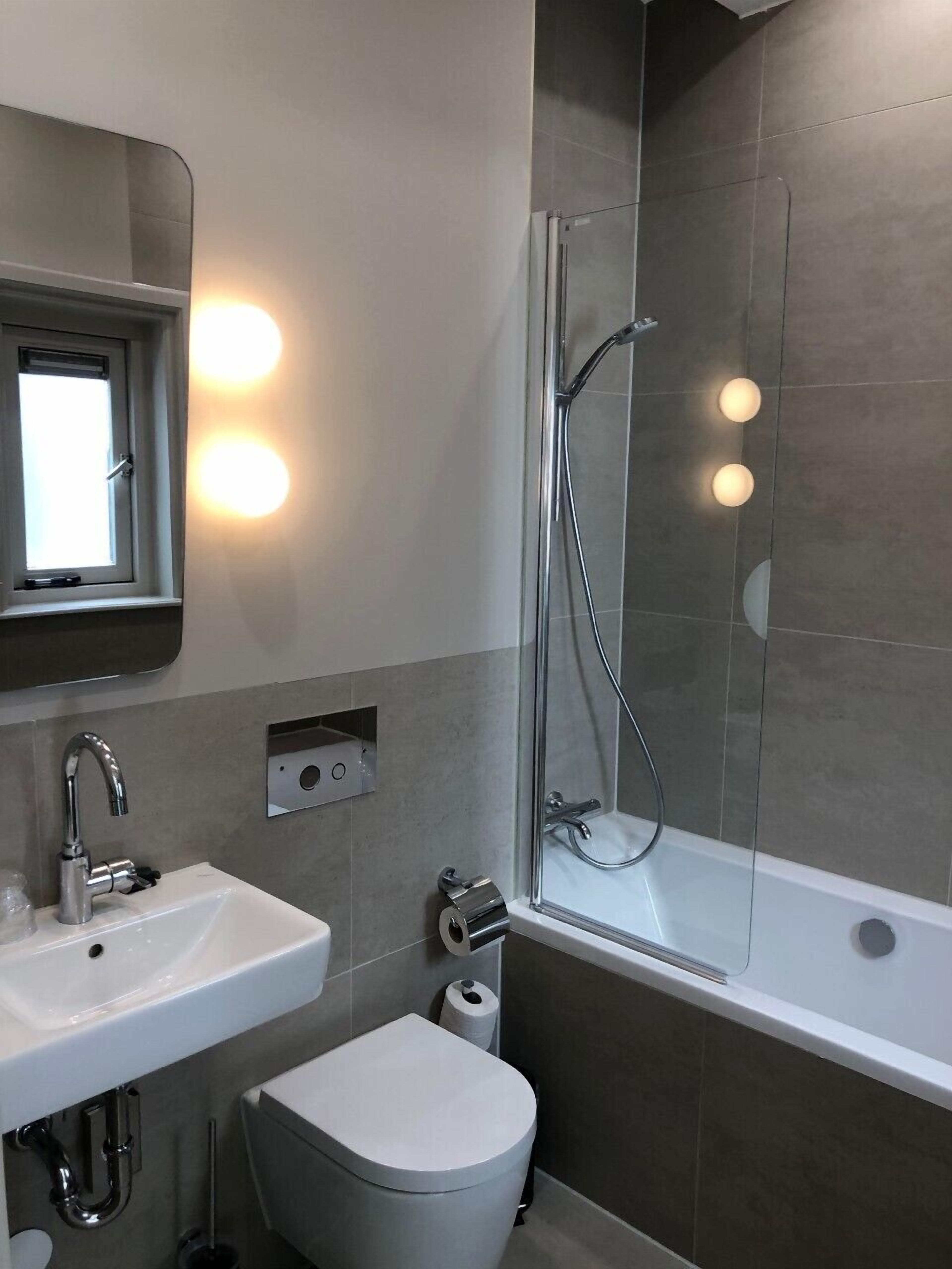 economy double room | bathroom | designer toiletries, hair dryer, towels, soap