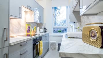 Fridge, oven, dishwasher, dining tables