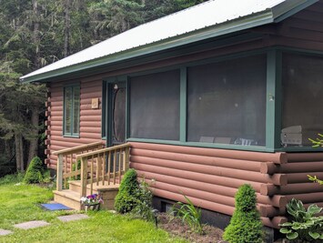 Enjoy the cool salty air on the porch and listen to rain on the tin roof !