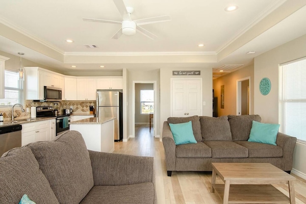 Relax in this beautifully decorated open-concept beach vacation home.