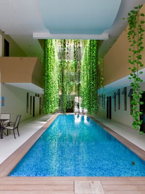 Indoor pool, open 8:00 AM to 9:00 PM, sun loungers - Palmarena Rooms and Residences - Long Stay Comfort with Parking, Sauna, Gym and Pool (Steps from 5th Avenue) (Playa del Carmen)