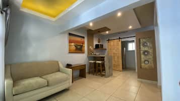 Suite, Multiple Beds | Living area | LED TV