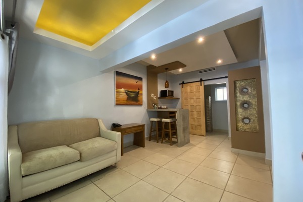 Suite, Multiple Beds | Living area | LED TV