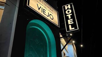 A hotel sign with 'HV' and 'Hotel' indicating the establishment.