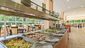 A buffet setup with various food options and utensils. - Gloria Saints Constantine And Helena (Varna)