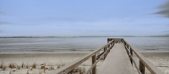 Waterfront island getaway with balcony, pool, tennis, & easy beach access