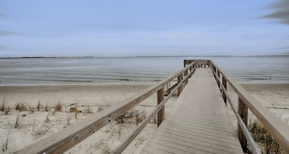 Waterfront island getaway with balcony, pool, tennis, & easy beach access