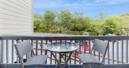 Waterfront island getaway with balcony, pool, tennis, & easy beach access