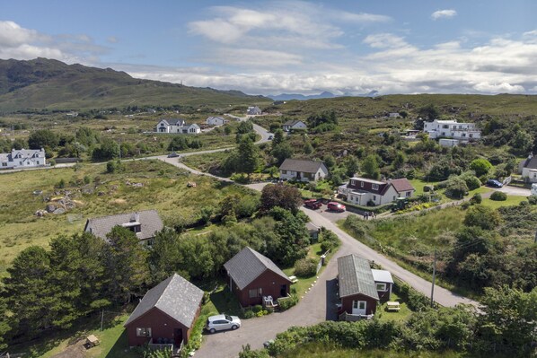 A residential area with houses, roads, and greenery. - Private holiday lodge with fabulous views "over the sea to Skye" (Arisaig)