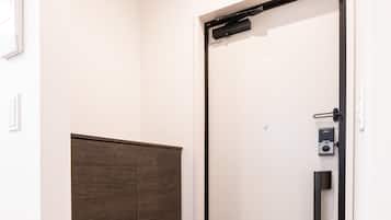 A modern elevator with a digital lock and a control panel.