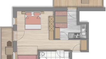 A floor plan with a bedroom, bathroom, kitchenette, and a living area with a sofa and coffee table.