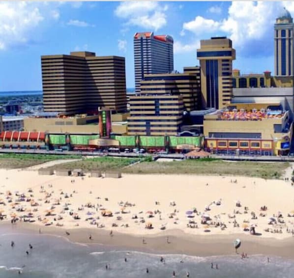 Enjoy a beachfront getaway with stunning views of the city skyline and a vibrant beach area.