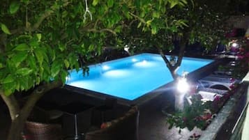 Seasonal outdoor pool, open 10:00 AM to 8:00 PM, pool umbrellas