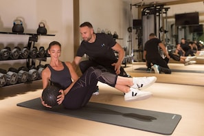 A gym with exercise equipment, including kettlebells and dumbbells. - The Woodward An Oetker Collection Hotel (Geneva)