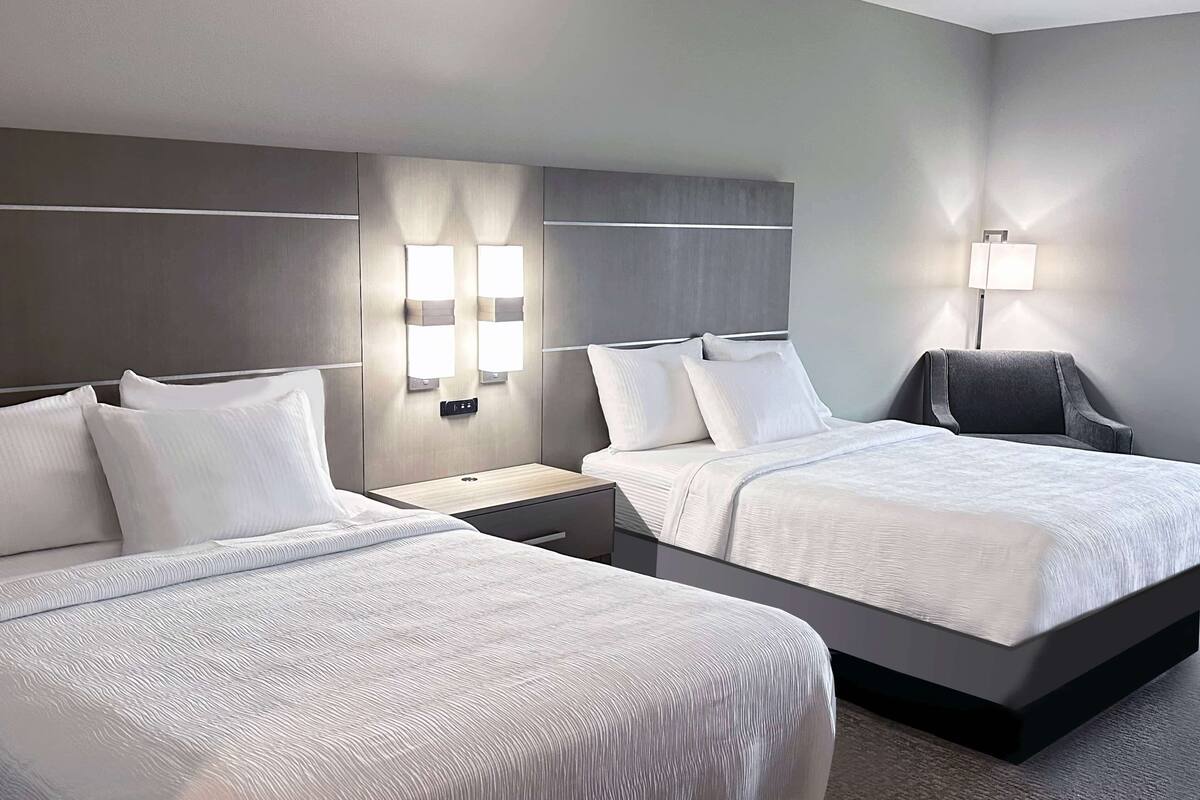 hypo-allergenic bedding, desk, laptop workspace, blackout curtains