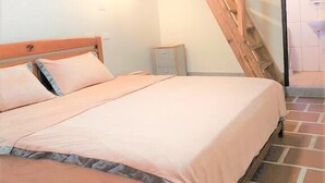 A bedroom with a wooden bed, a small bedside table, a wooden ladder, and a tiled floor. - O! Share Sweet B&B II (Jinning)