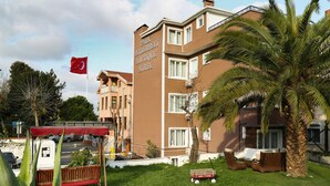 A hotel with a sign reading "Park Beylerbeyi Boutique Hotel".