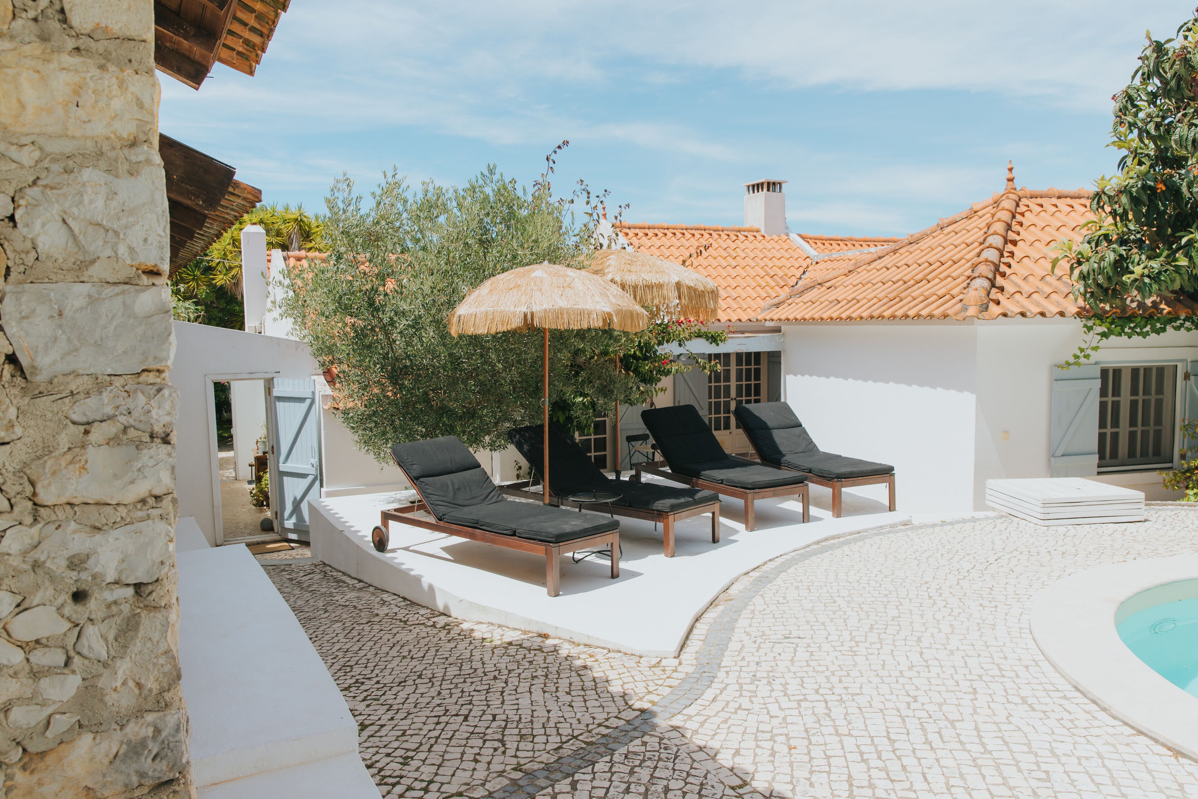 A poolside area with lounge chairs and a small pool.