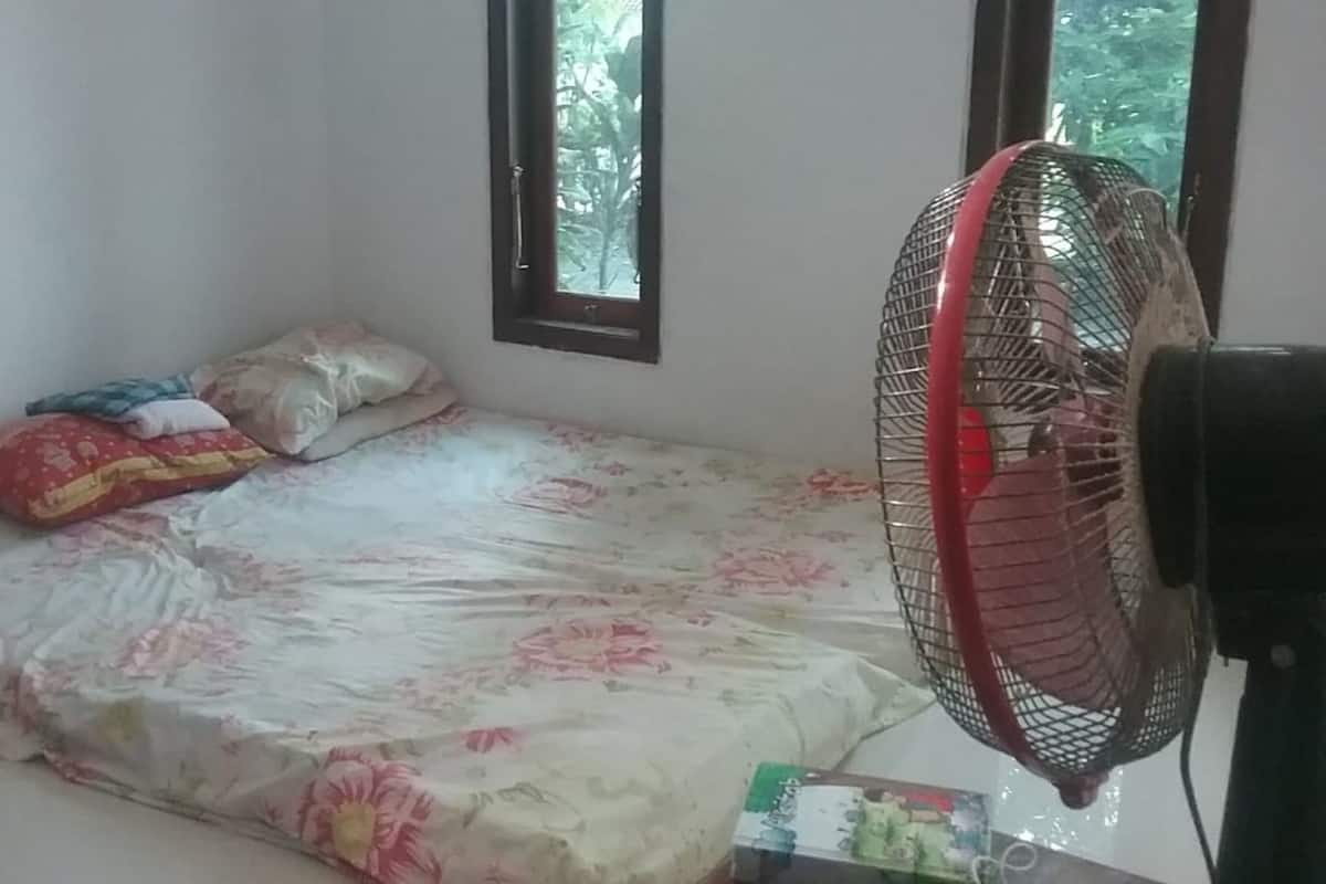 Laptop workspace, bed sheets