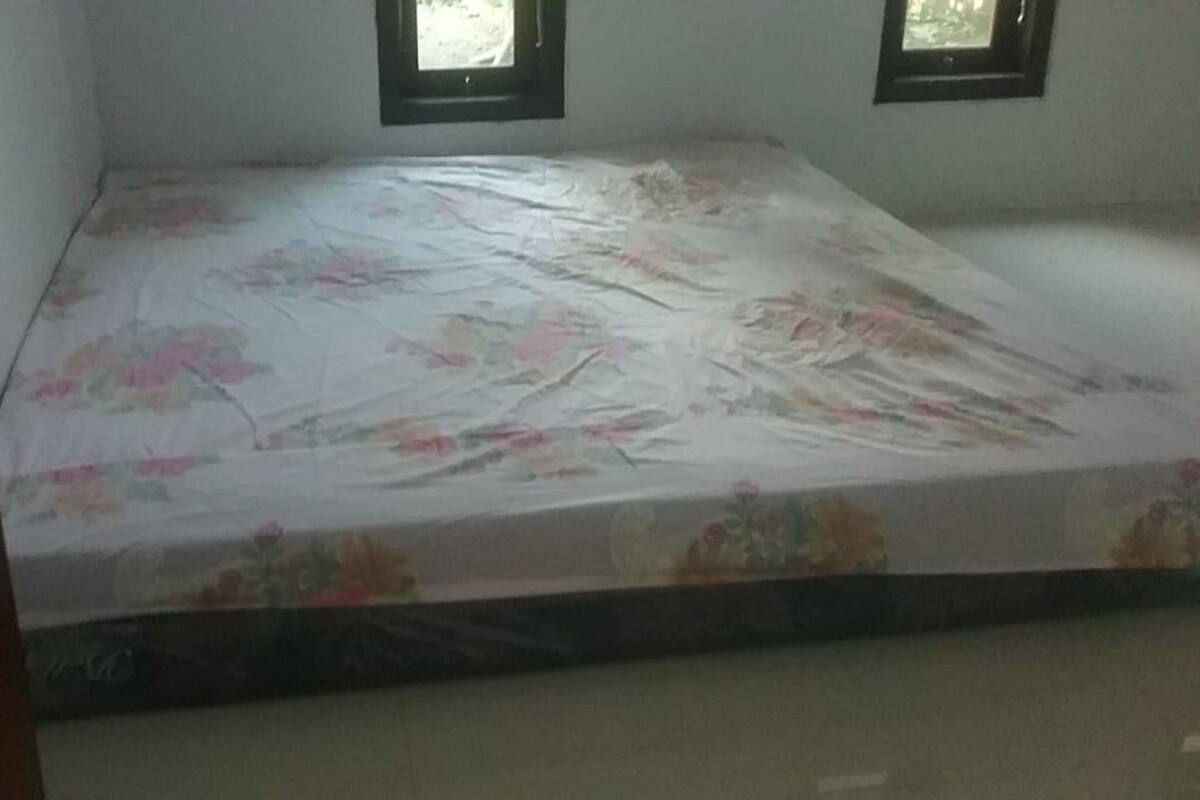 Laptop workspace, bed sheets