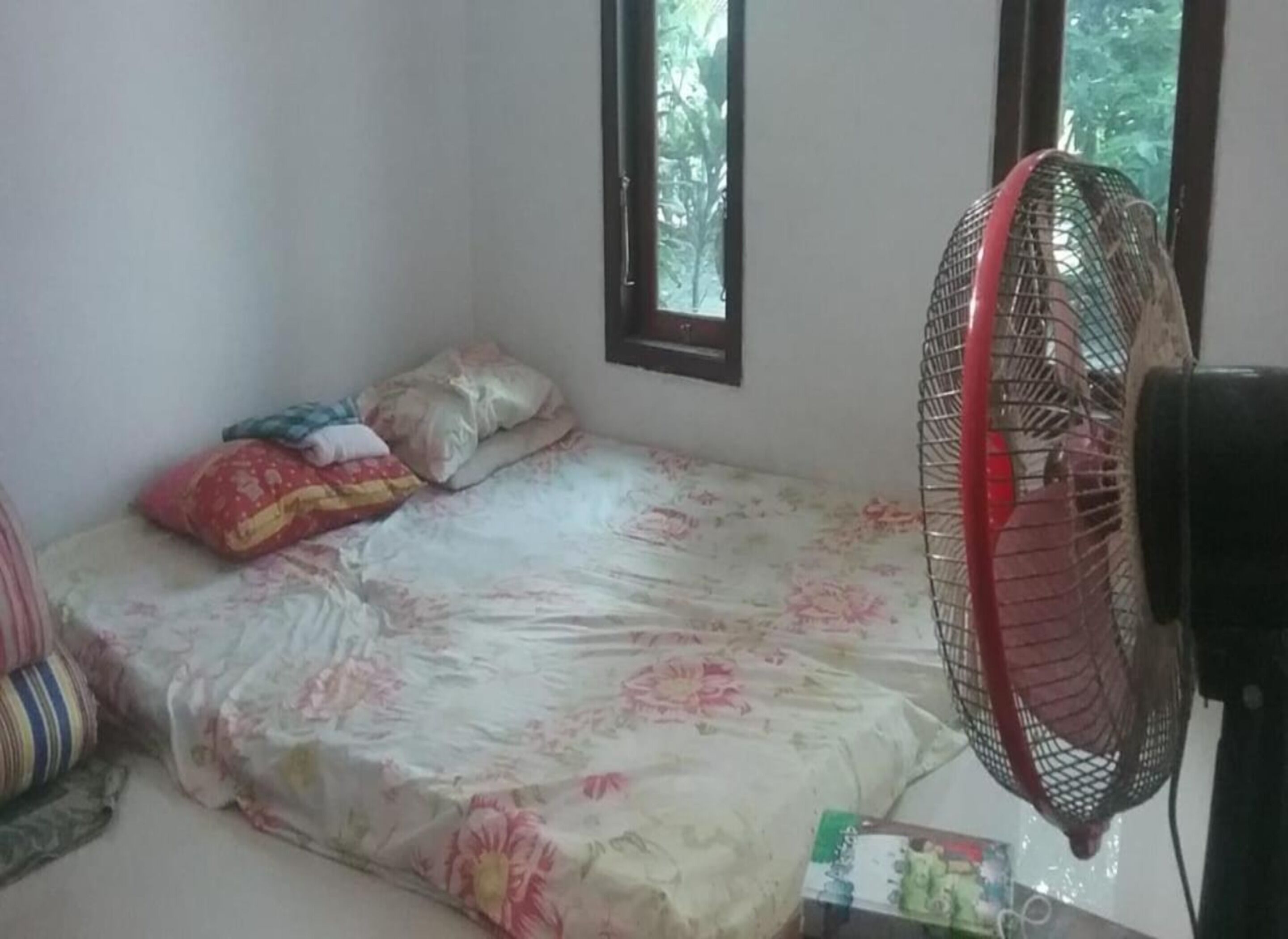 Laptop workspace, bed sheets