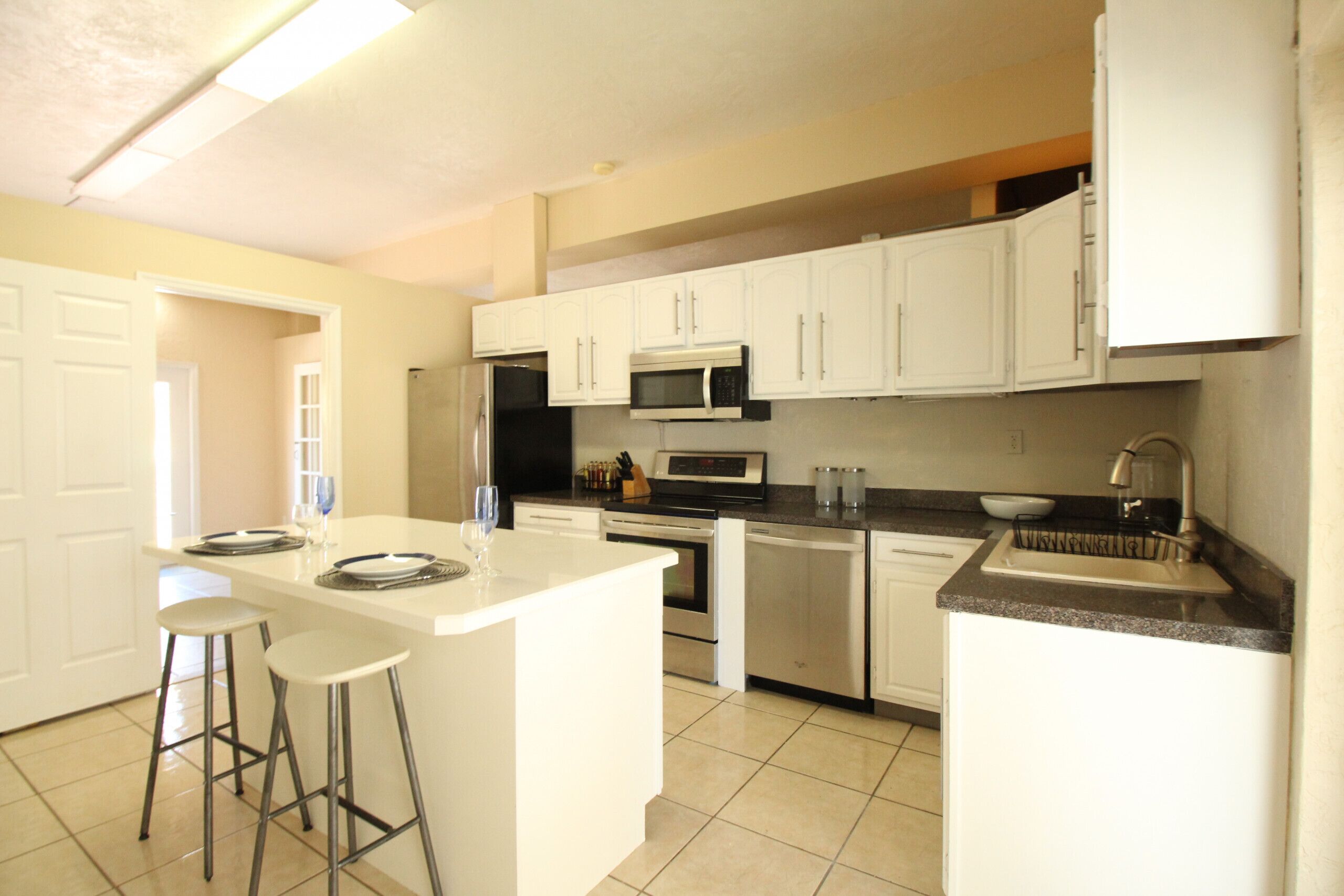 Microwave, dishwasher, coffee/tea maker, cookware/dishes/utensils