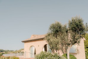 A building with a tiled roof, arched windows, and a white fence. - Rent room Nontiscordardimè (Civitanova Marche)