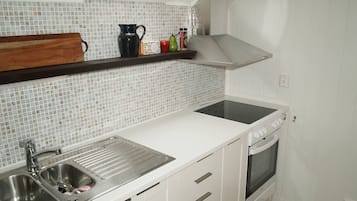 Fridge, stovetop, coffee/tea maker, cookware/dishes/utensils