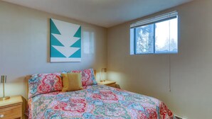 A bedroom with a bed, nightstands, a window, and a wall art piece. - Stunning Lake Dillon and Keystone Views from a Cozy Mountain Retreat (Dillon)