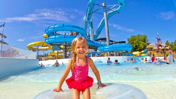A water park with multiple water slides and a pool area. - Whippoorwill Hill: Easy Access Guadalupe Riverfront, Great Patios, Mins to Whitewater Amphitheater (Canyon Lake)