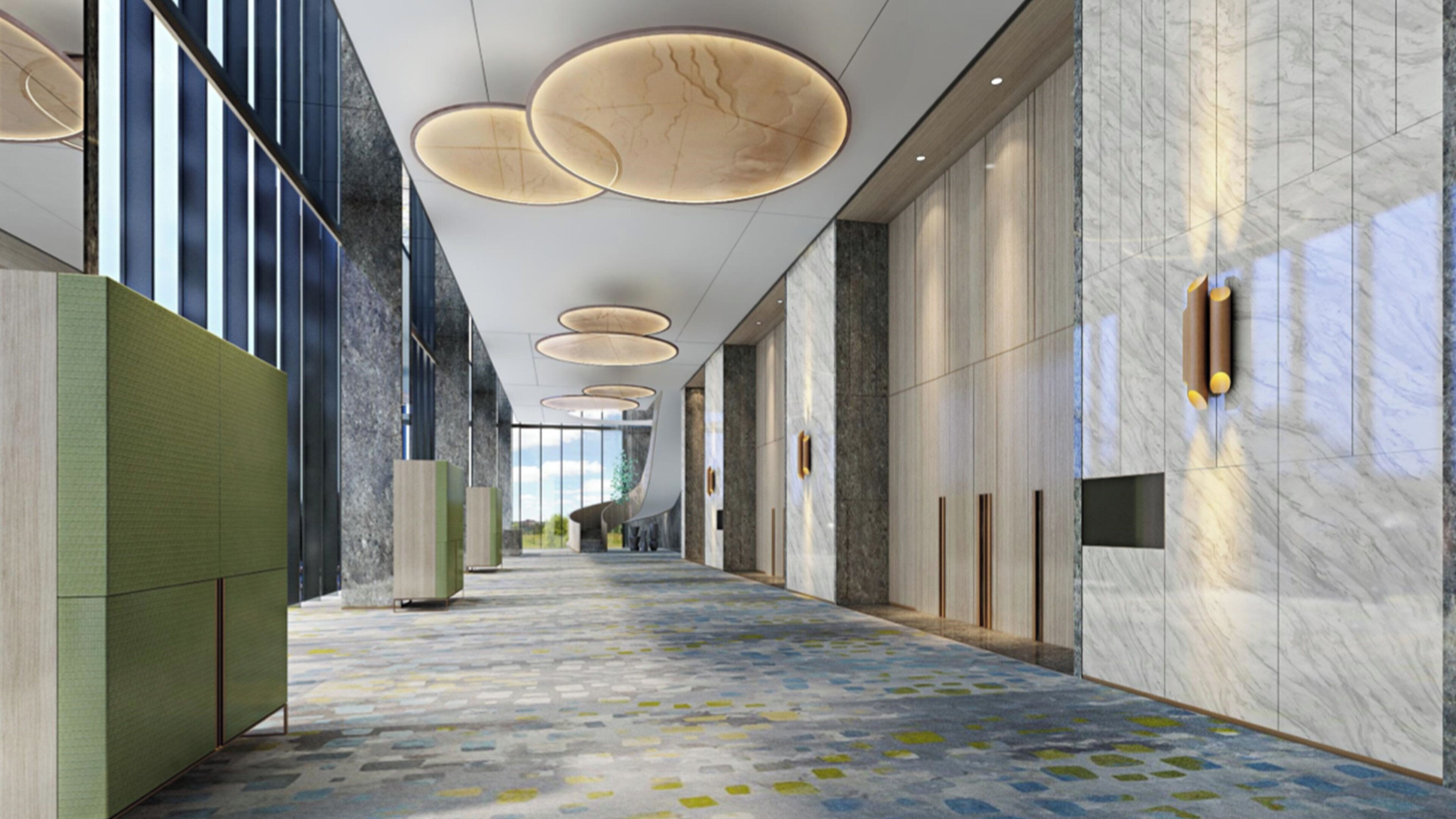 A modern hotel corridor with a patterned floor, large circular ceiling lights, and marble walls.