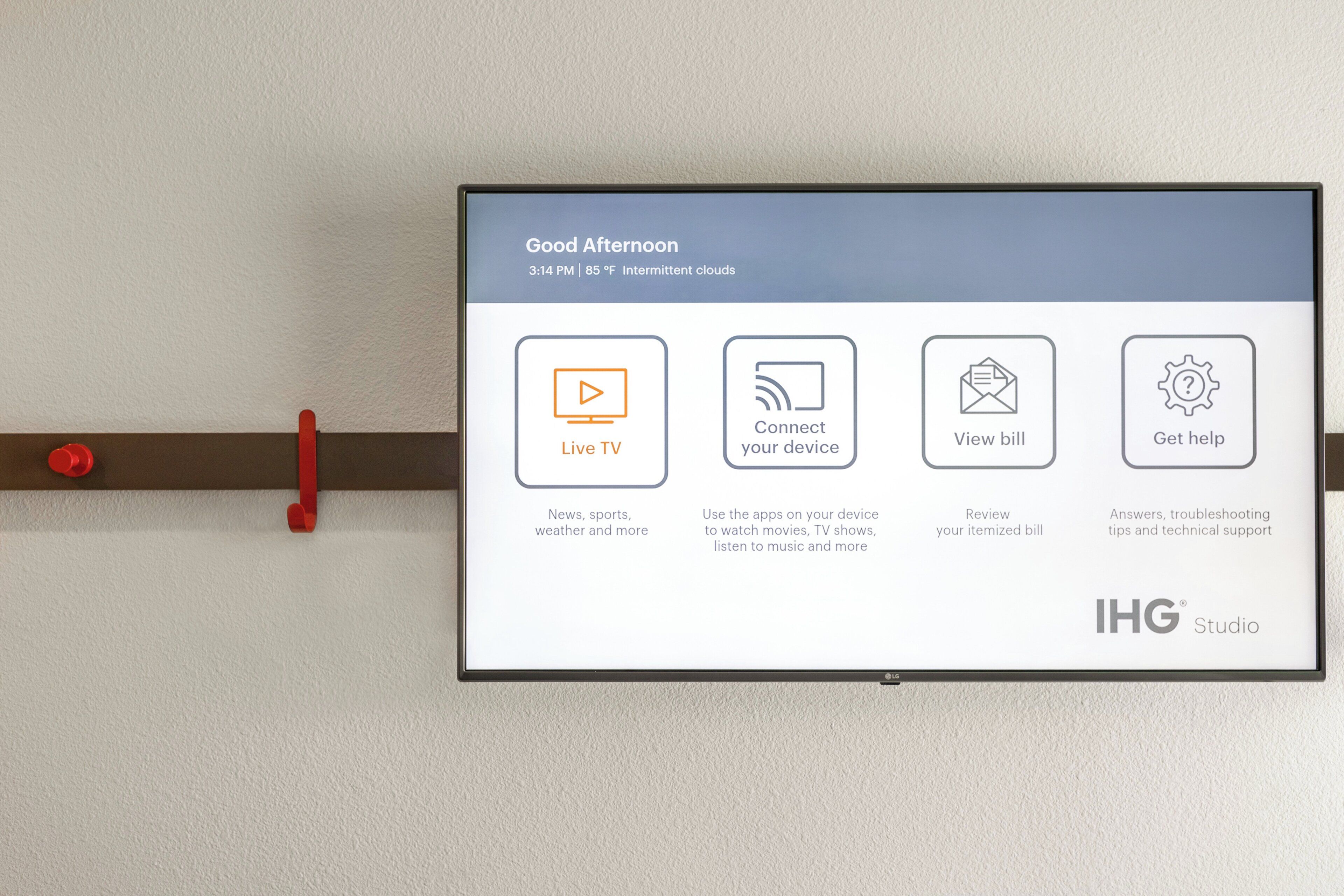 A digital display with a message 'Good Afternoon' and four icons for services: Live TV, Connect your device, View bill, and Get help.