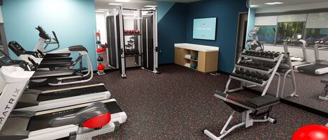 A gym with treadmills, weight machines, and a wall-mounted TV.