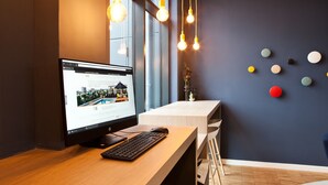 A modern office desk with a computer, keyboard, and mouse.
